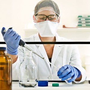 lab technician putting sample in test tube